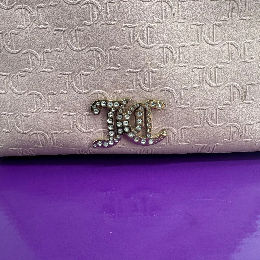 Y2K Juicy Couture satchel in pink, features an all-over embossed 